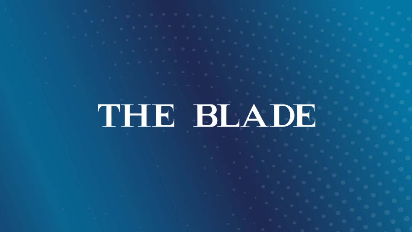 White The Blade Logo on blue background